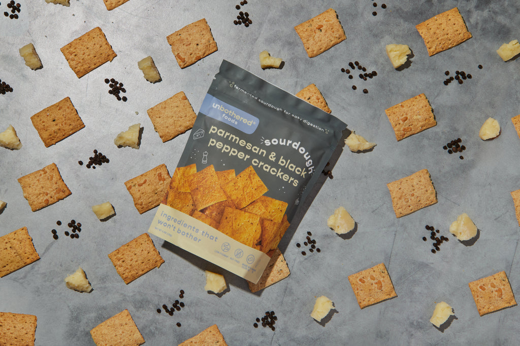 Parmesan & Black Pepper sourdough crackers on a board