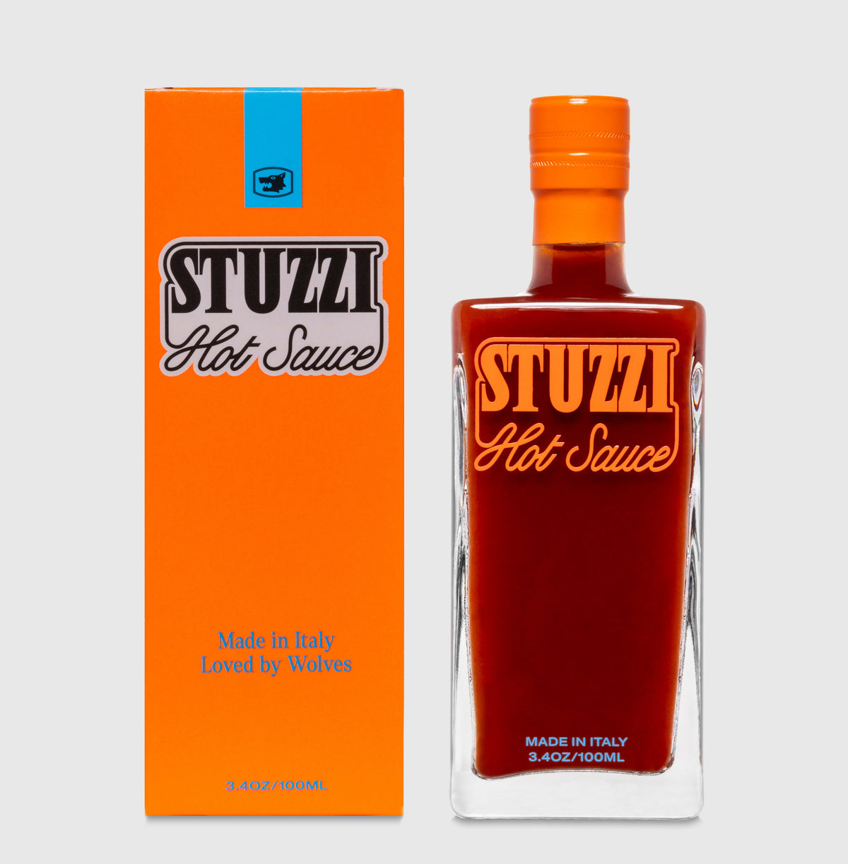 Stuzzi hot sauce bottle beside its printed box